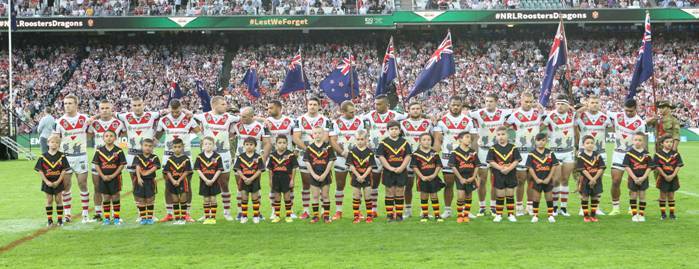 Proud day: Arncliffe Scots juniors line up with St George Illawarra players prior to the 2015 Anzac Day game against the Sydney Roosters. Picture: Supplied