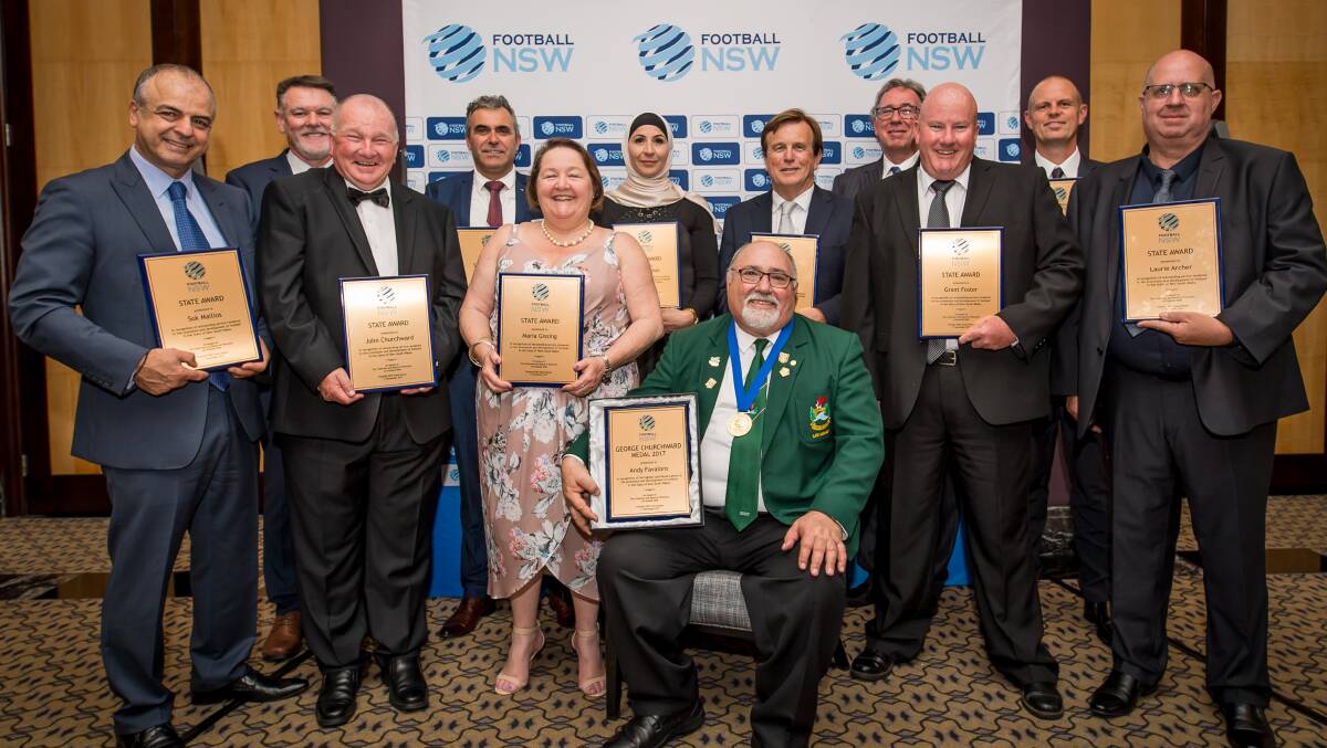 Well deserved: Peter Mallios (far left) and Keith Ward (fourth from right) at the Football NSW state dinner. Picture: Football NSW