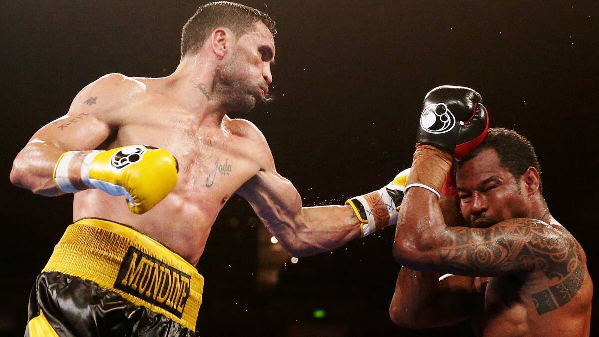 Anthony Mundine on his way to a win over boxing legend Shane Mosley in 2013. Picture: Mark Metcalfe/Getty Images