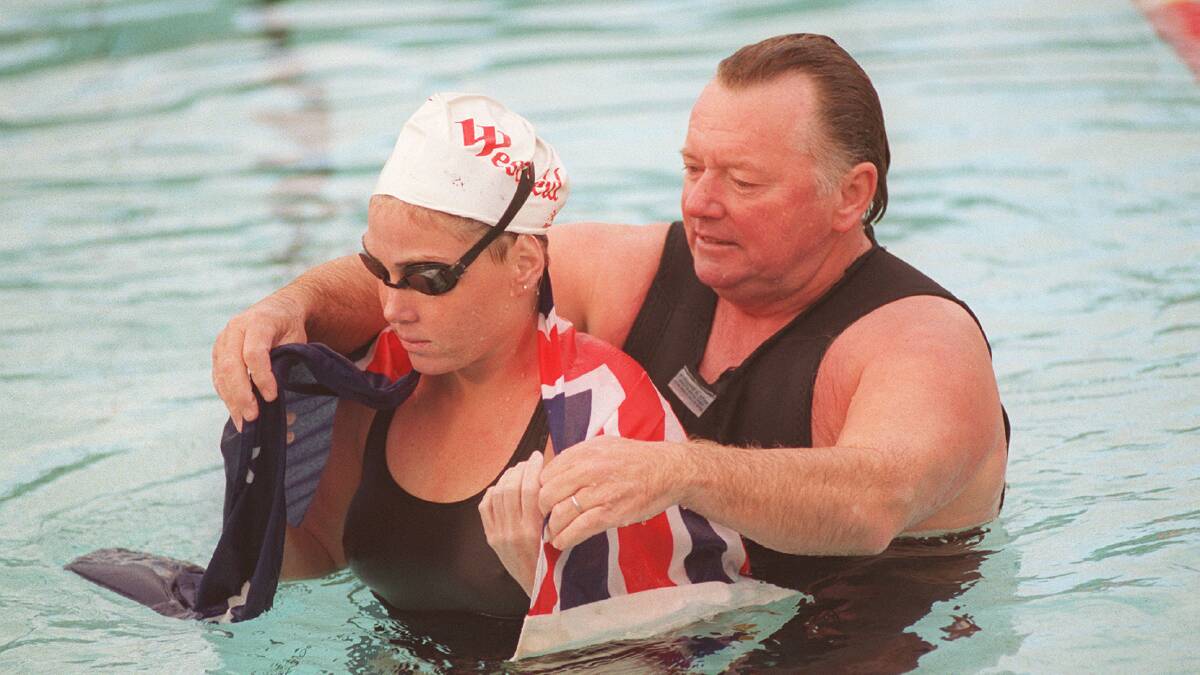 Two legends: Dick Caine (right) with Susie Maroney after her world record 24-hour swim at Carss Park Memorial Pool in 1995. Picture: John Veage