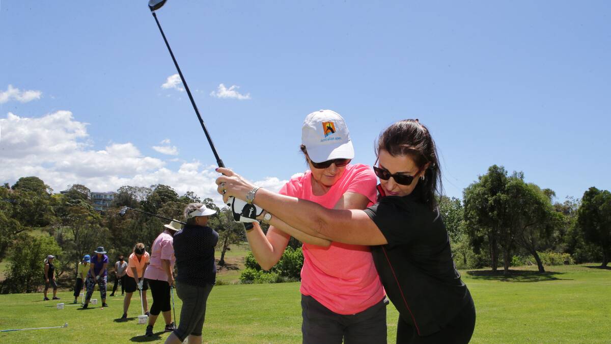 In the swing: SwingFit instructor Andrea McGann (right) assists a player at Bardwell Valley Golf Club last week. Picture: John Veage