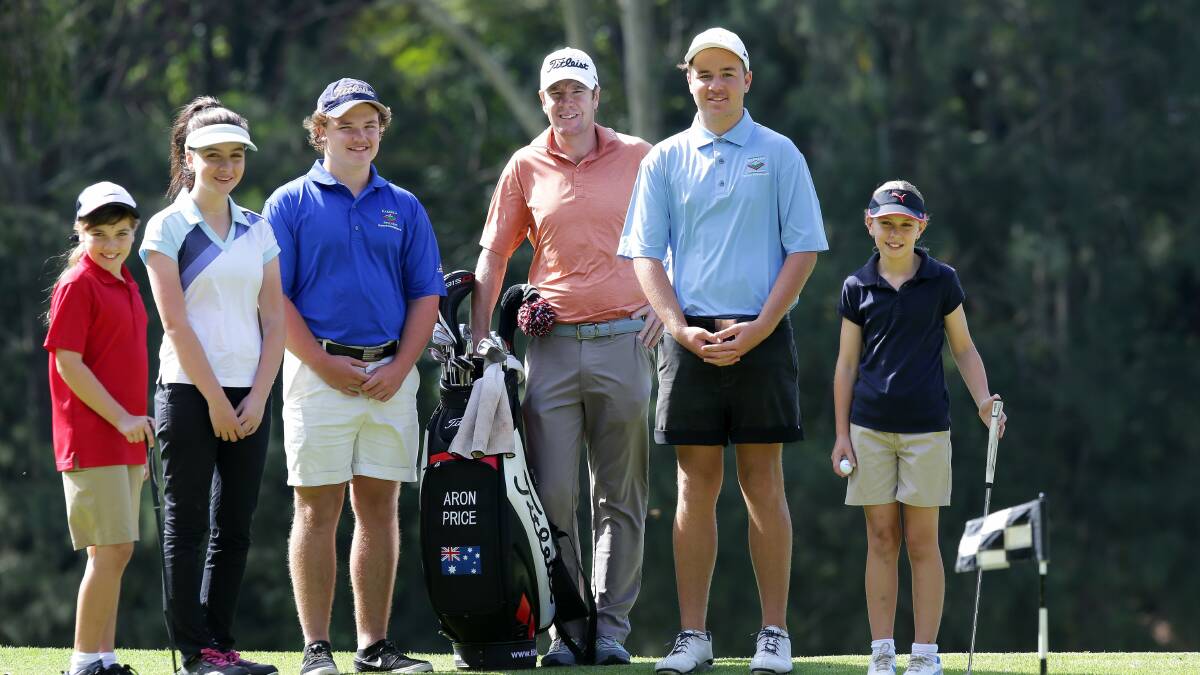 Professional Aron Price with Kareela Golf Club juniors. Picture: John Veage