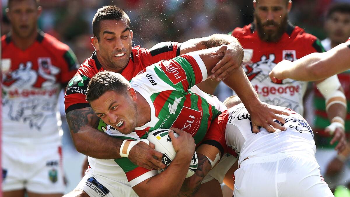 Tough day at the office: New Dragons signing Paul Vaughan tackles Souths prop Sam Burgess during the Charity Shield loss. Picture: Ryan Pierse/Getty Images