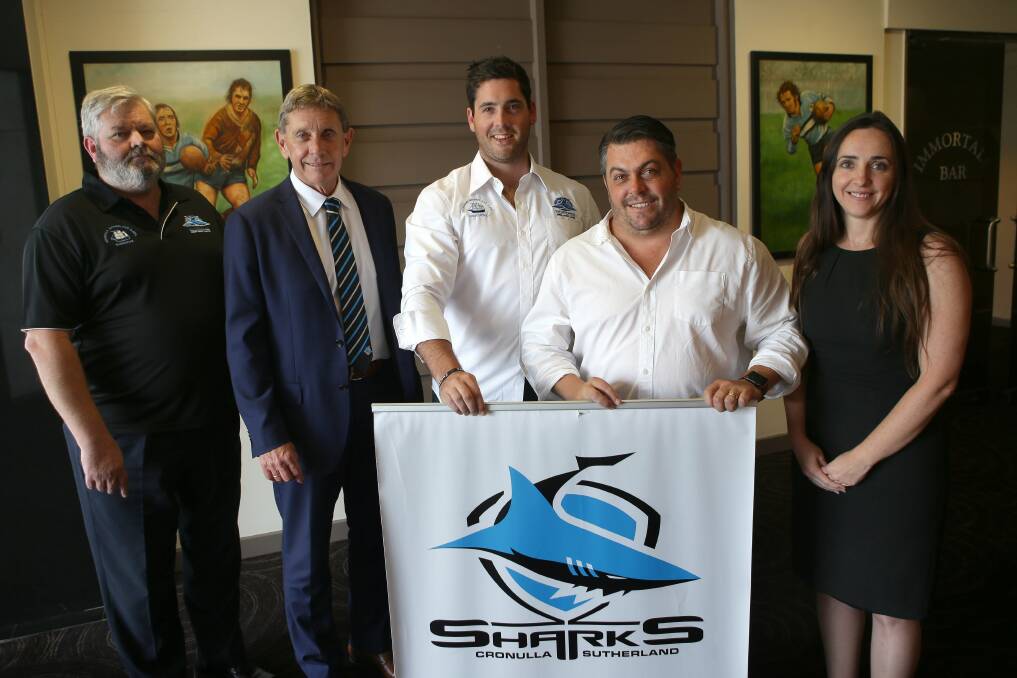 Welcome addition: Cronulla-Sutherland District Junior Rugby League president Michael Hingert, Cronulla Sharks CEO Lyall Gorman, junior league general manager Nathan Waugh, Feros Group CEO Chris Feros and Feros Group marketing director Jennifer Walter. Picture: John Veage
