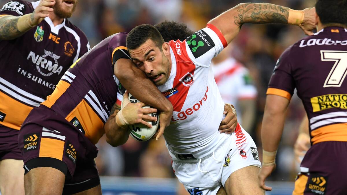 No way through: Dragons prop Paul Vaughan is tackled against Brisbane on Friday night. Picture: Dan Peled/AAP Image