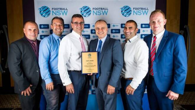 Peter Mallios (front right) with SGFA directors. Picture: Football NSW