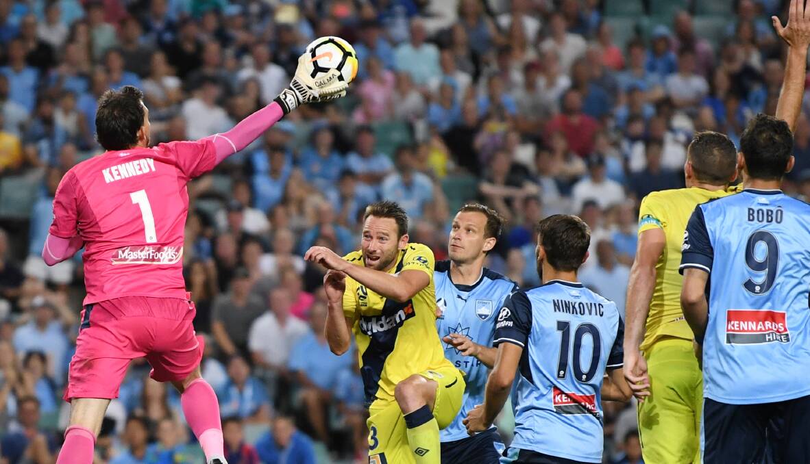 Mariners goalkeeper Ben Kennedy defuses another Sydney FC attack. Picture: AAP