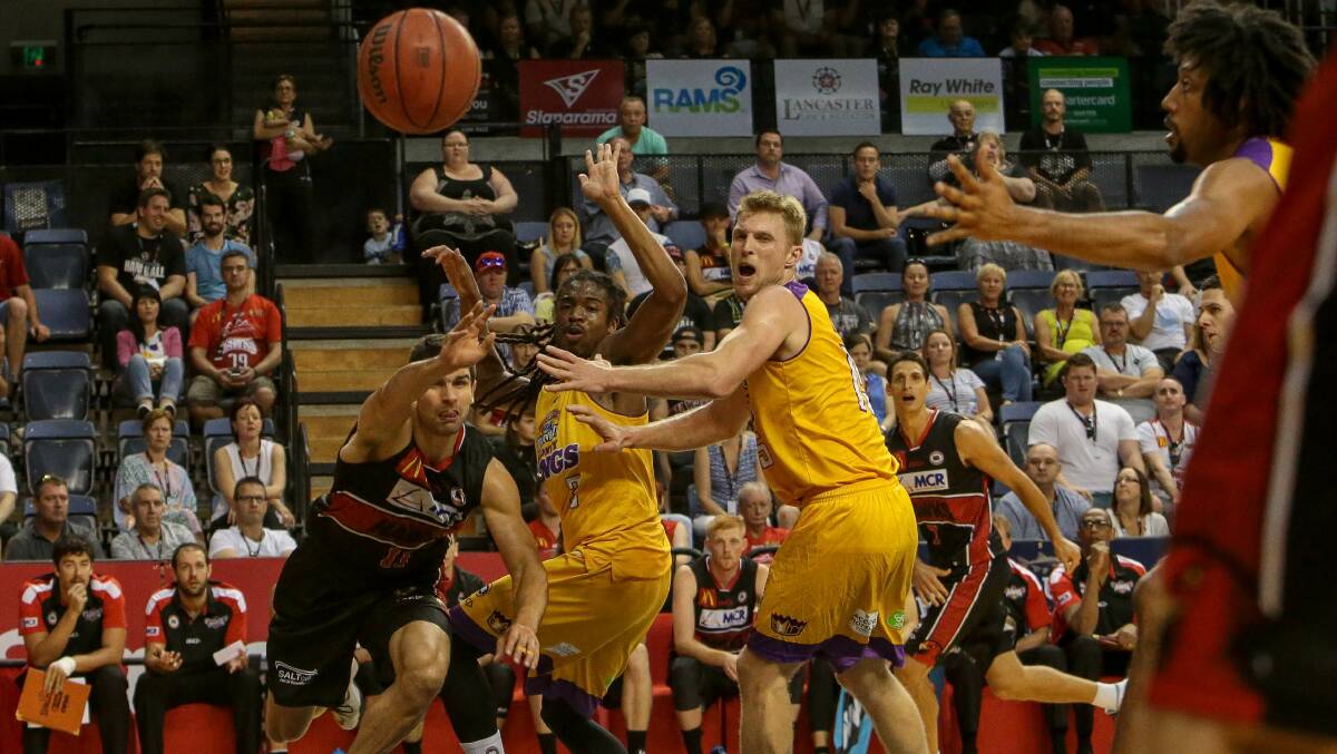 Changing colours: Kevin Lisch (left) playing for the Hawks against the Kings last season. Picture: Adam McLean