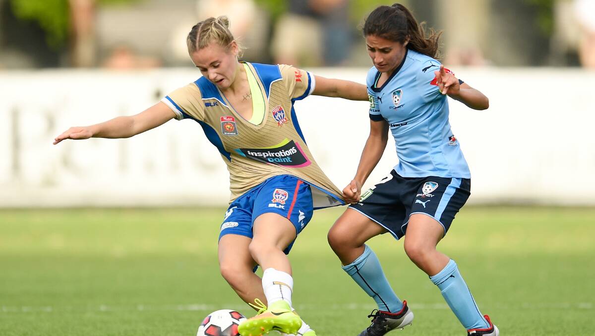 Teresa Polias (right) battling hard against the Newcastle Jets this season. Picture: Getty Images