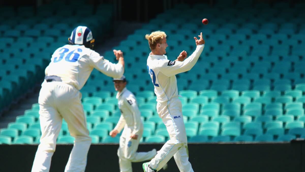 Got him: Sutherland spinner Daniel Fallins celebrates his first Sheffield Shield wicket for NSW at the SCG. Picture: AAP