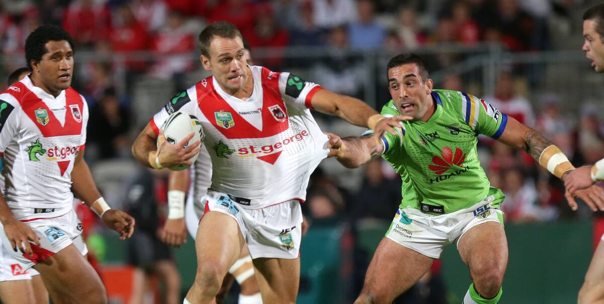 New friends: St George Illawarra winger Jason Nightingale was caught by new teammate Paul Vaughan when the Dragons hosted Canberra at Kogarah last season. Picture: John Veage