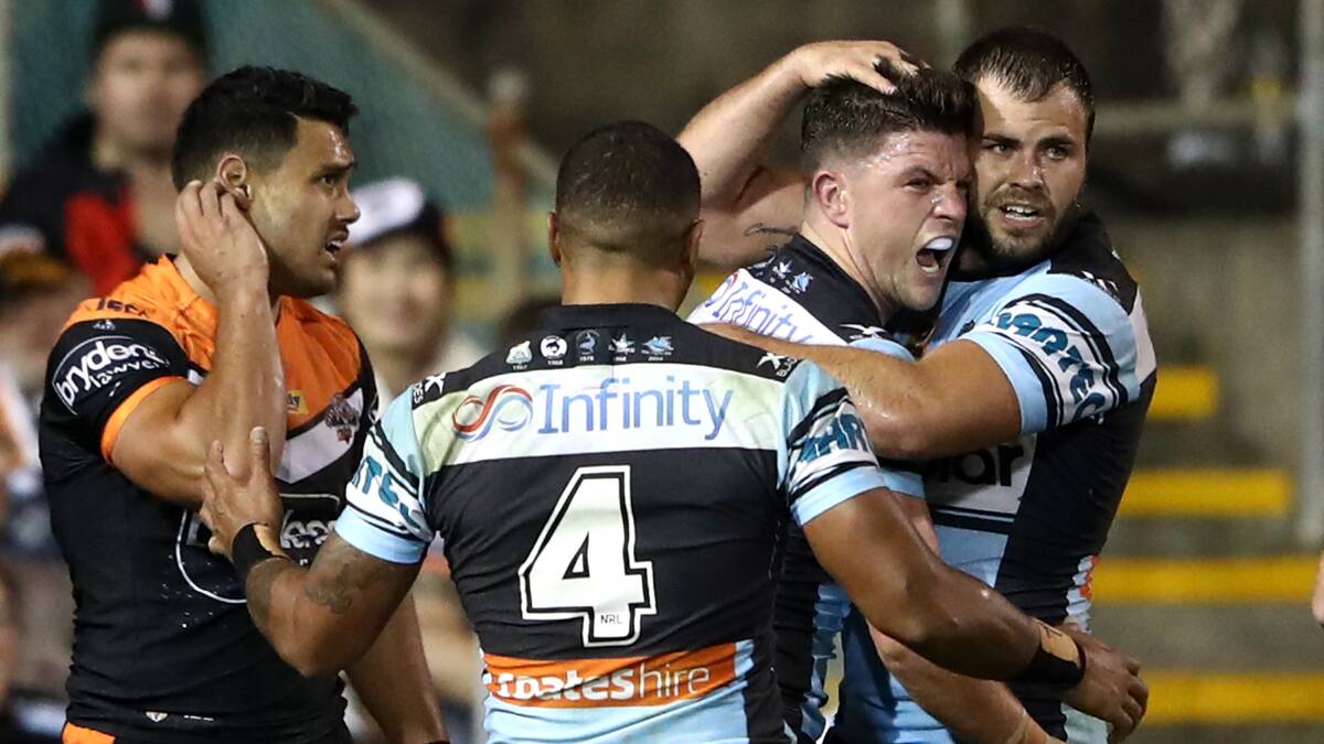 Match winner: Cronulla Sharks halfback Chad Townsend is congratulated on his late solo try by Wade Graham. Picture: Cameron Spencer/Getty Images