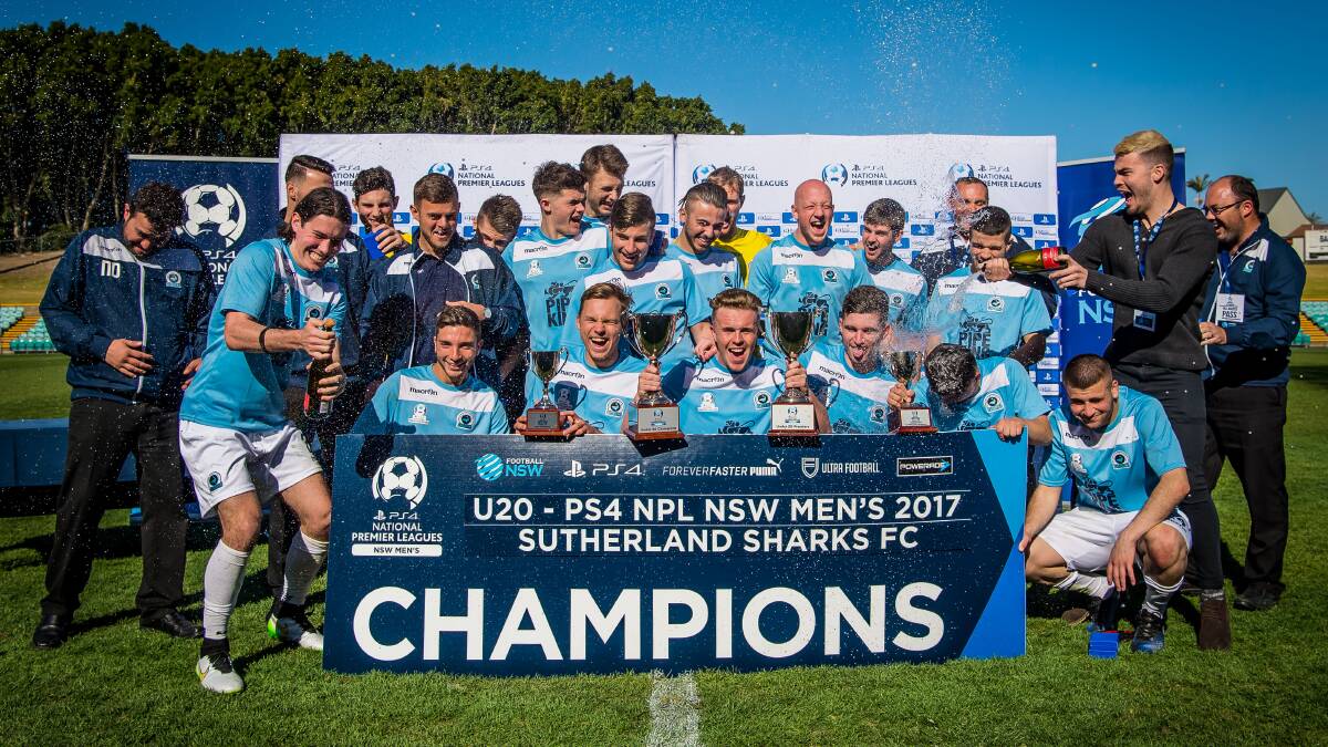 Champions: The Sutherland Sharks under-20s side celebrate their premiership-grand final double on Sunday. Picture: Football NSW/George Loupis