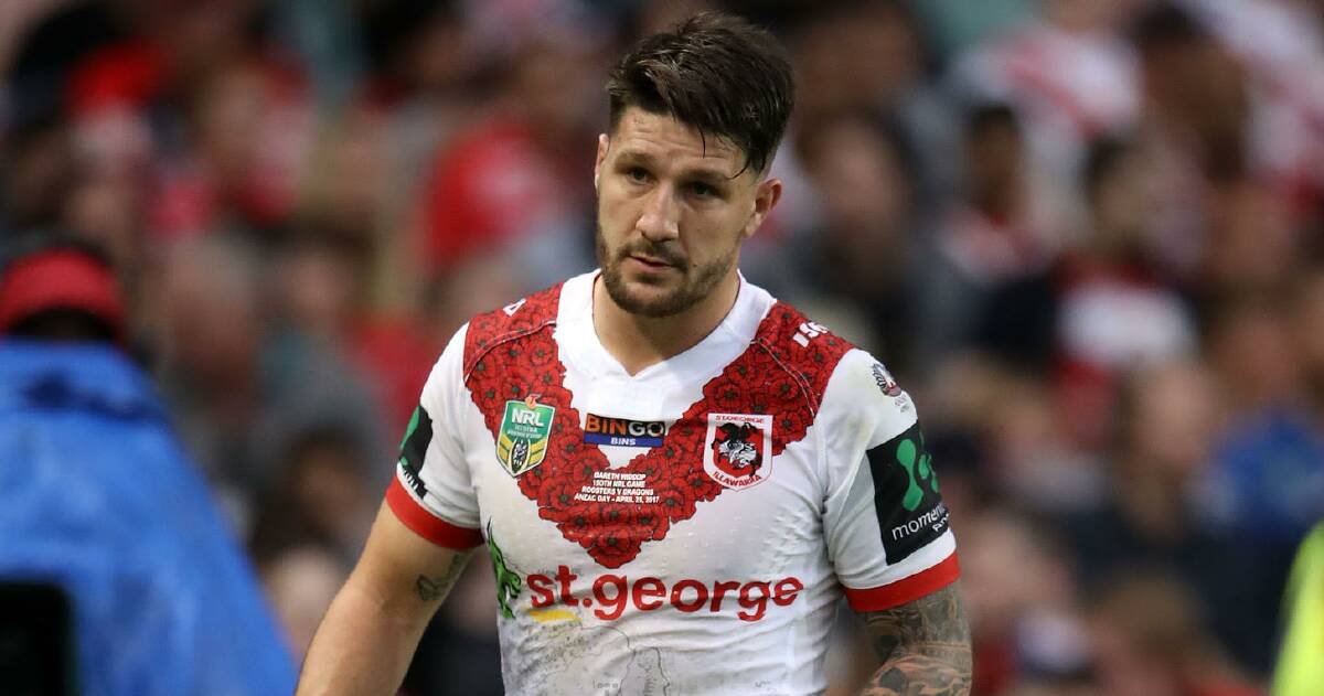 Dragons captain Gareth Widdop hobbles off just before half-time on Tuesday. Picture: Getty Images