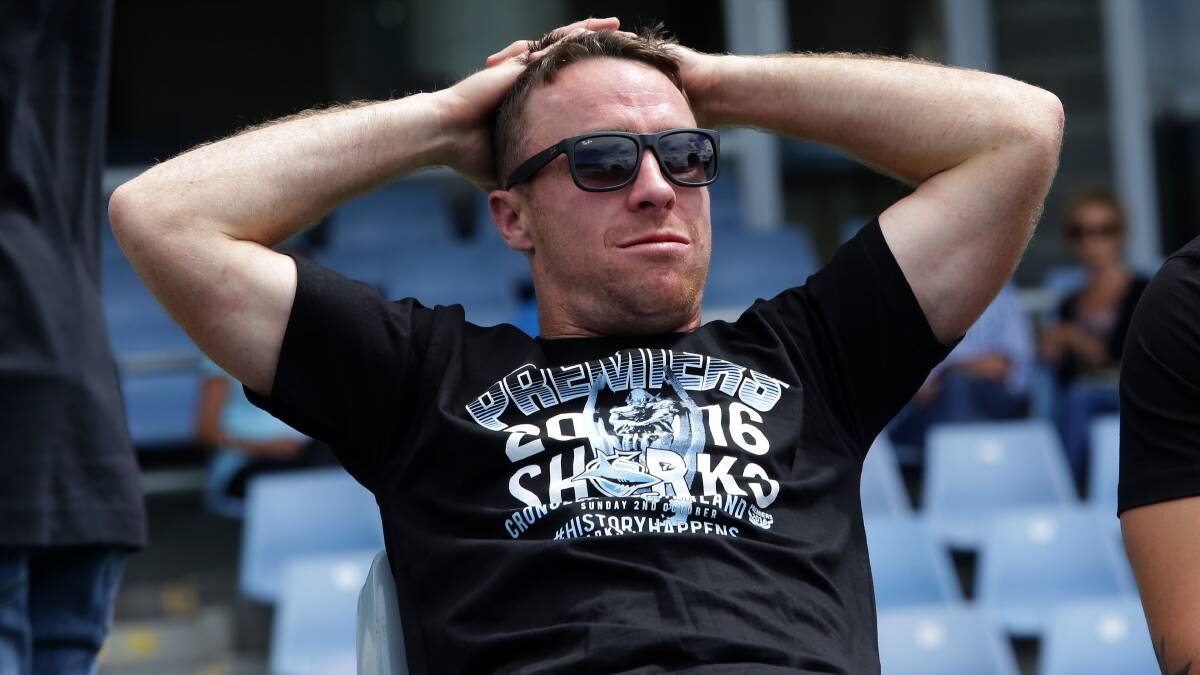 Not going anywhere: Cronulla five-eighth James Maloney celebrating the day after the Sharks' grand final victory. Picture: John Veage
