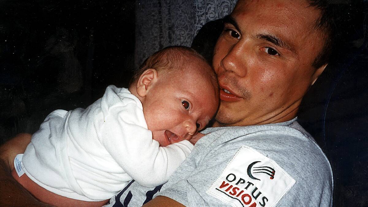 Happy days: Kostya Tszyu with son, Nikita, aged 1. Picture: Fairfax Media