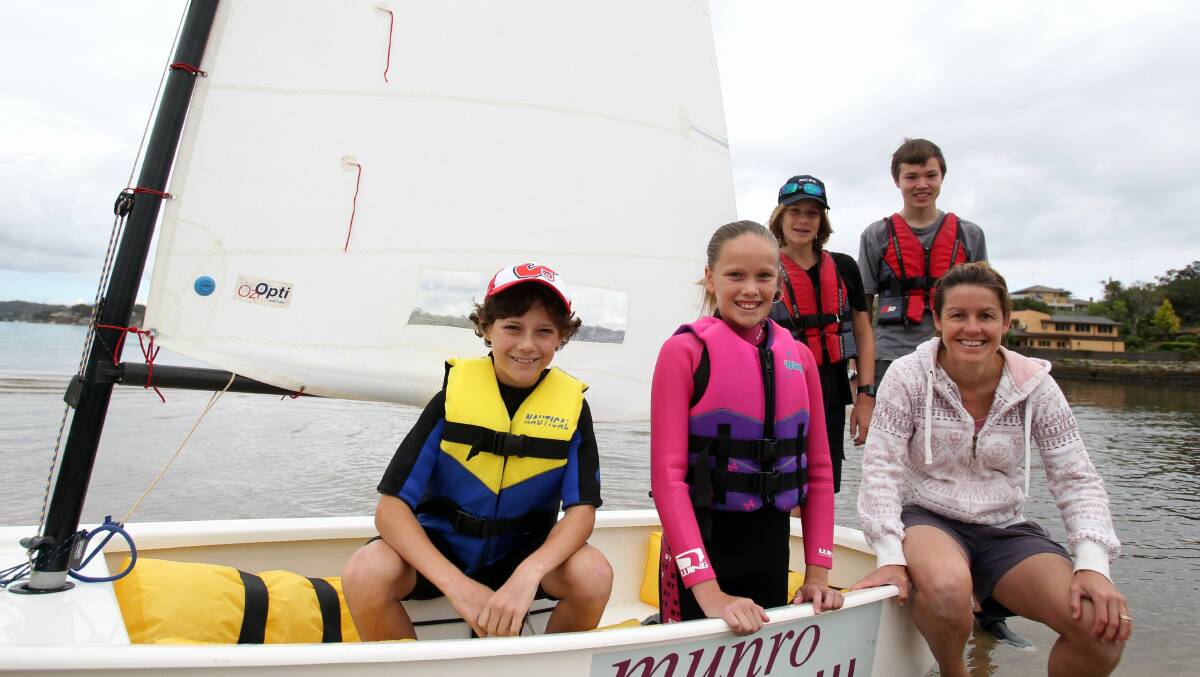 All smiles: Connells Point Sailing Club members Thomas Henwood, Jaime Greig, Sam Ebenezer, Cameron Gordon and Karen Branch in 2014. Picture: Chris Lane