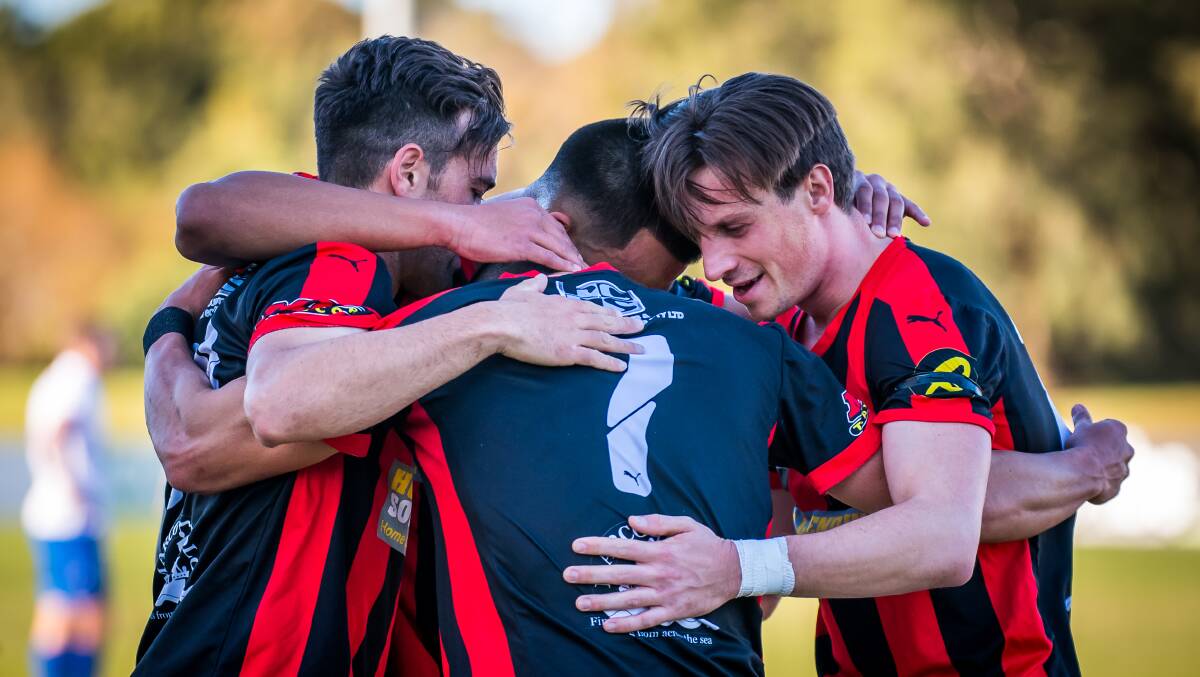 Winners: Rockdale City players celebrate Alec Urosevski's second goal as the Suns downed Bonnyrigg on Sunday. Picture: Football NSW