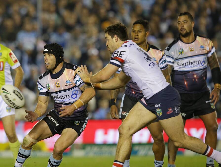 New look: Sharks players Michael Ennis, Ben Barba and Andrew Fifita wearing the Battlefield 1 inspired jersey against the Roosters on Saturday night. Picture: John Veage