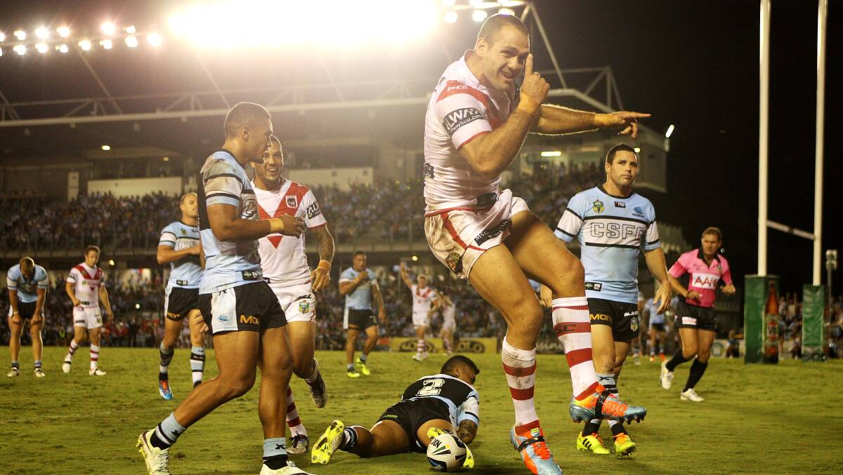 Veteran: Dragons winger Jason Nightingale, celebrating a try against Cronulla in 2014, will play in his 20th derby match against the Sharks. Picture: Getty Images