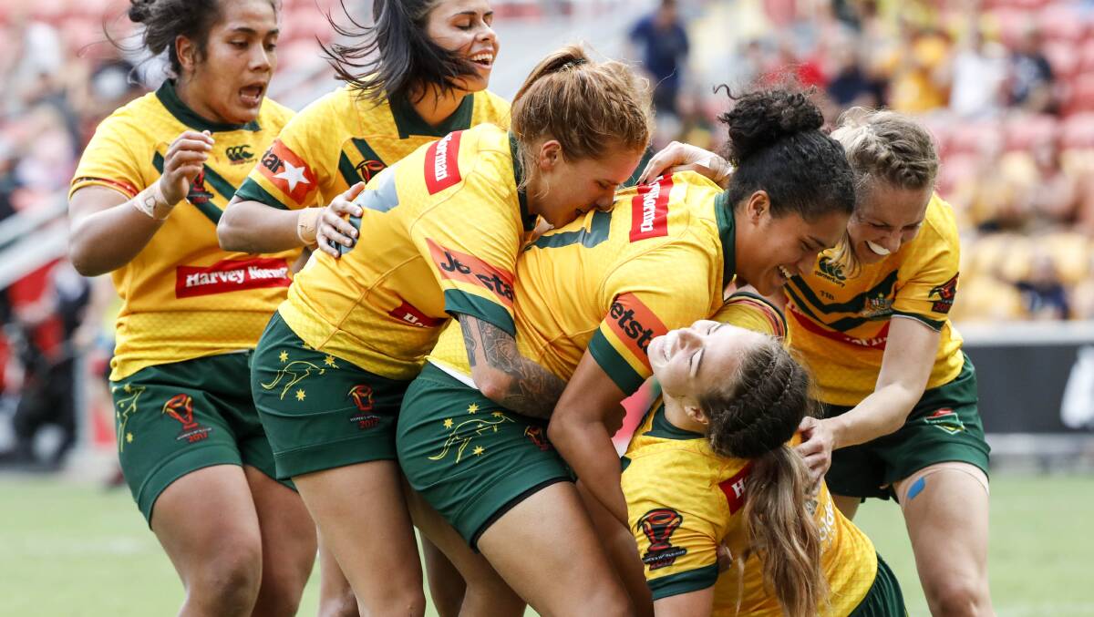 This is it: Jillaroos players celebrate an Isabelle Kelly try during their seven-point victory. Picture: AAP
