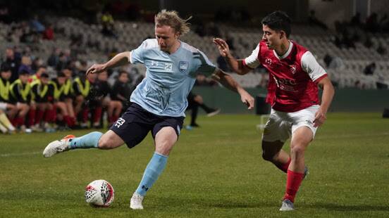 Good hit out: Sydney FC defender Rhyan Grant dribbles the ball against St George City in their friendly on Tuesday night. Picture: Supplied