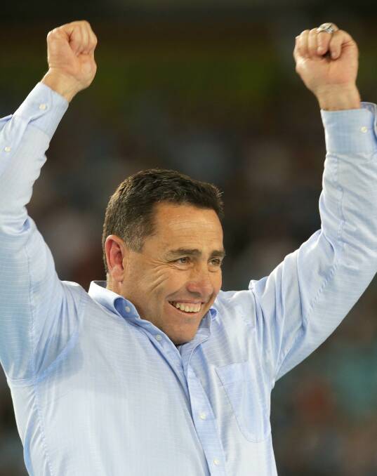 This is it: Cronulla Sharks coach Shane Flanagan celebrates at ANZ Stadium on Sunday night. From plumber to premiers. Picture: John Veage