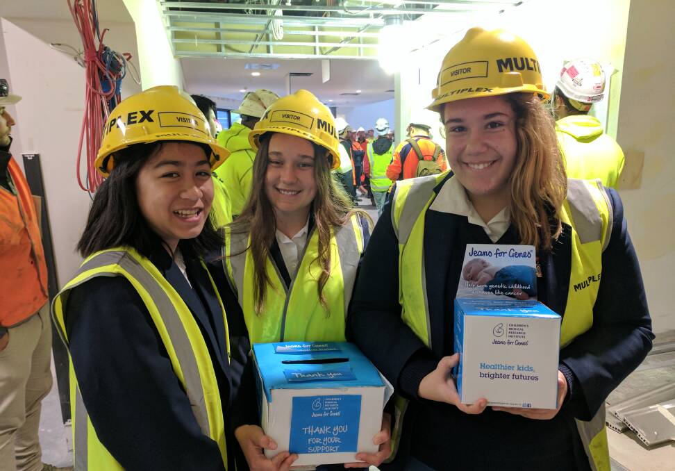 Collection: Students from the school visit a nearby construction site to help raise funds. Picture: Supplied