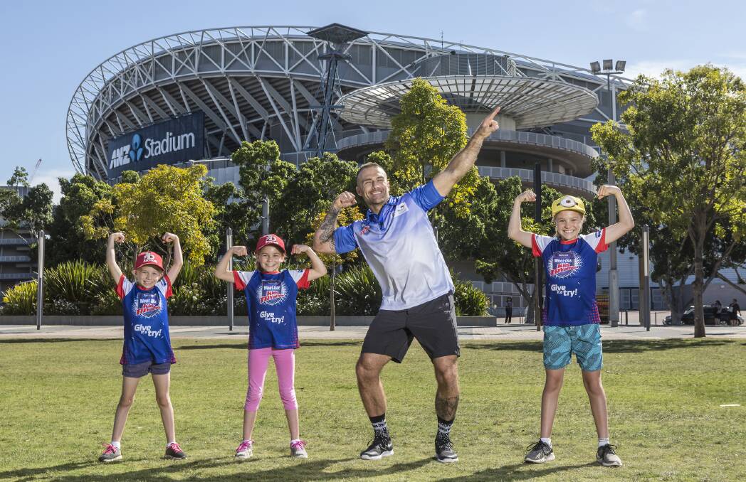 Tryathlon: Pictured (from left) are sisters Abby, 7, Jasmine, 9, and Lily Beck, 11, alongside ambassador Steve Willis. Picture: Supplied