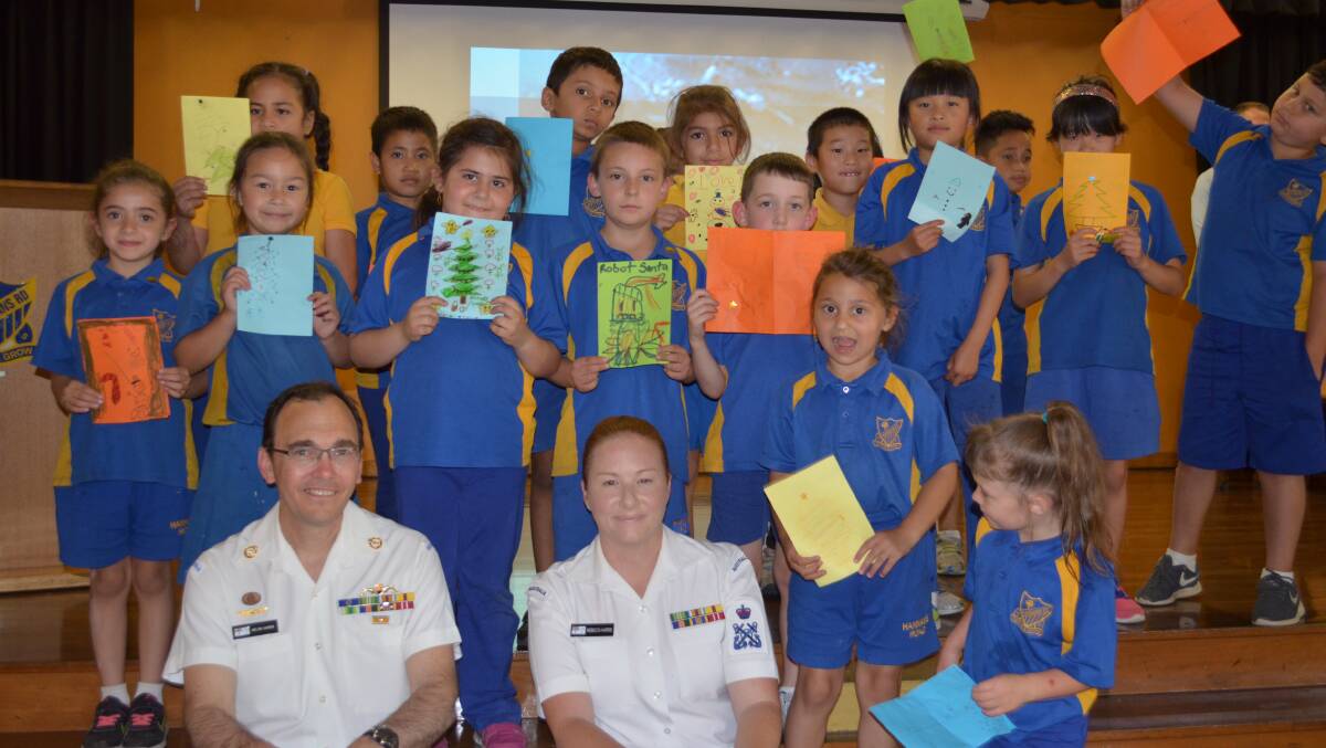 Best wishes: Children from Hannans Road Public School with the cards they made for the Australian Defence Force. Picture: Supplied