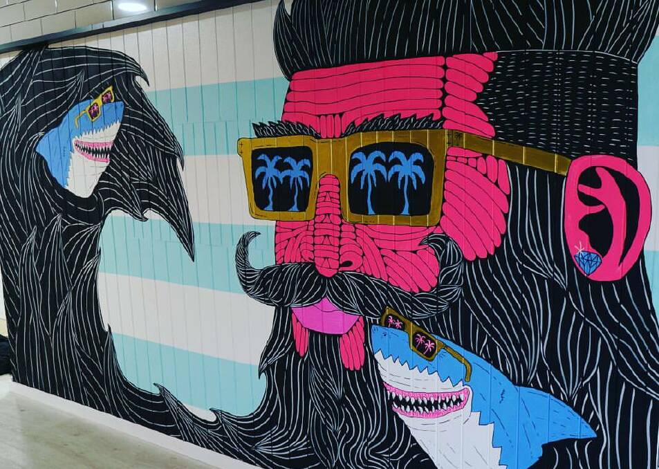 Painting: The new mural, Shark Beard Shane, at the Hair Shed in Cronulla. Picture: Joel Moore