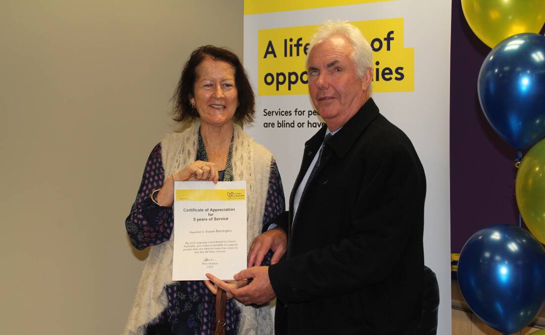 Long service award: Vision Australia's Michael Simpson recognises volunteer Susan Barrington. Picture: Supplied