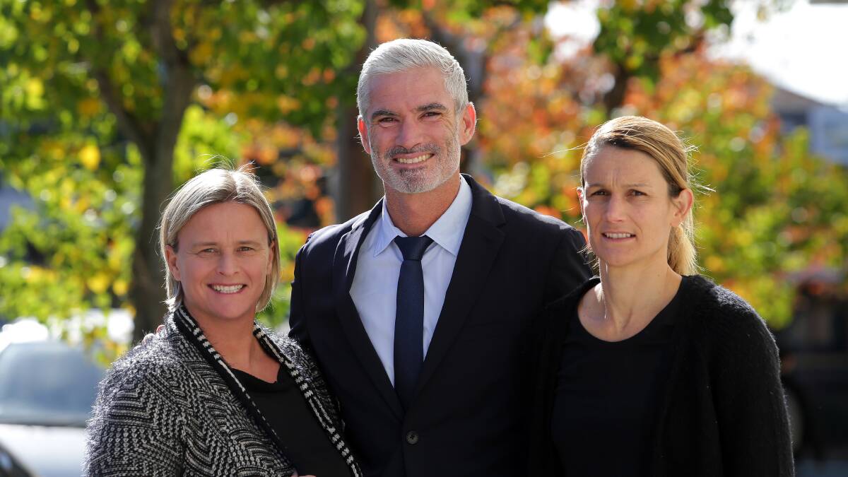 Backing: Former Matilda legends Dianne Cleary (right) and Julie Murray (left) with former Socceroo Craig Foster. Picture: John Veage