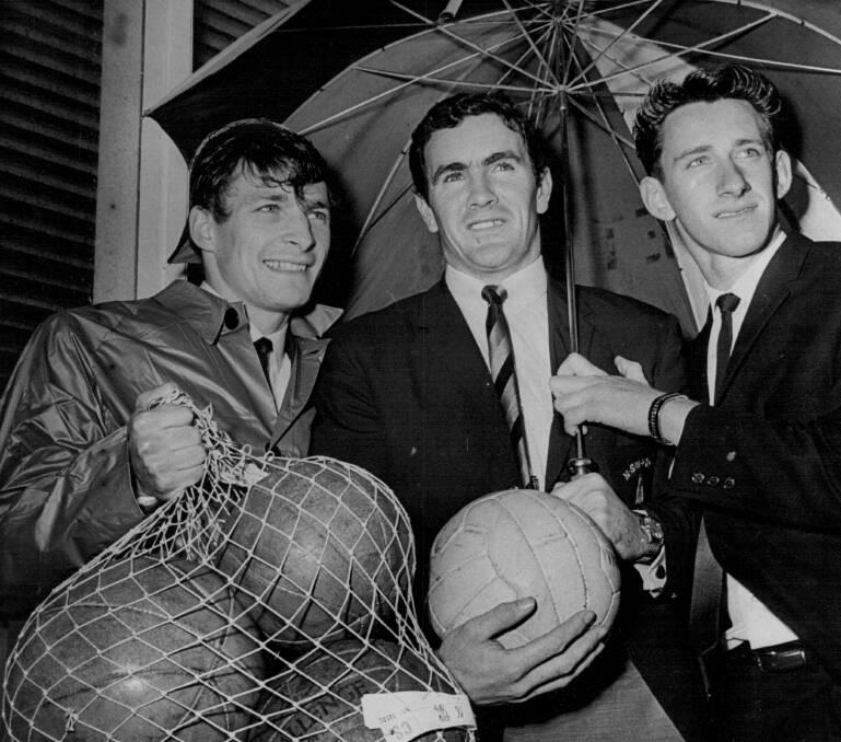 Captain: Pat Hughes (centre) alongside fellow Socceroos Dave Todd (left) and Bill Rorke in 1965. Picture: File