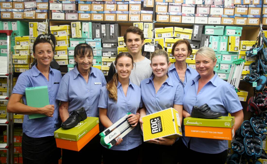 Back to school: Staff at Wilson Family Shoe Store in Jannali have enjoyed a busy sales period as parents get their children ready for school. Picture: Chris Lane