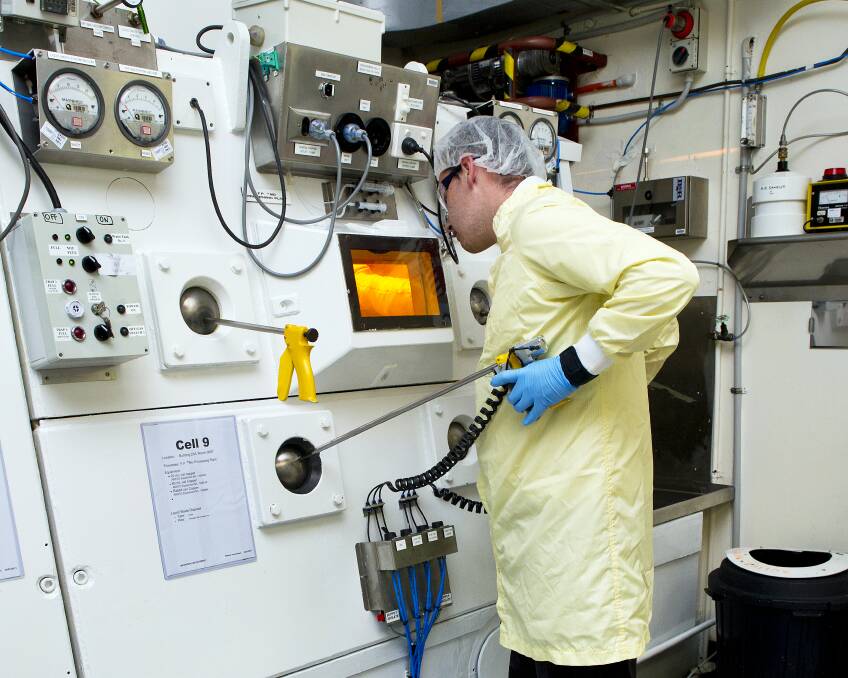 Nuclear: An ANSTO staff member working with a hot cell, developing nuclear medicine. Picture: Supplied