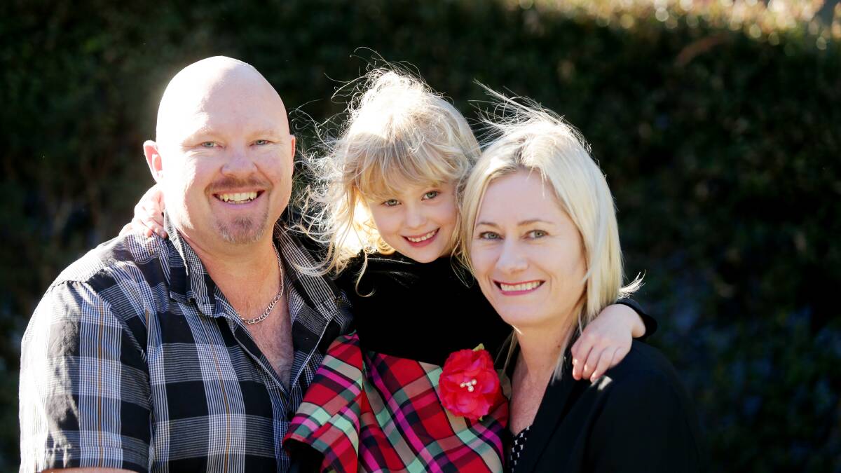 Cancer survivors: Parents Brad and Leanne Reeves with their daughter Mia, 4. Picture: Chris Lane