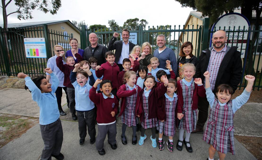 Happy days: Parents and children at Kyeemagh Infants School celebrate their school being expanded. Also pictured is Rockdale MP Steve Kamper (centre back). Picture: John Veage