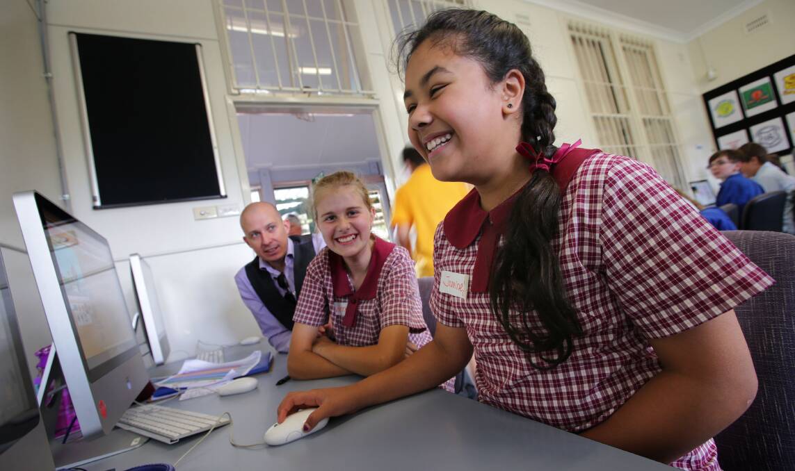 Competition: Students take part in the Ansto Top Coding grand final yesterday at Caringbah Public School. Picture: John Veage