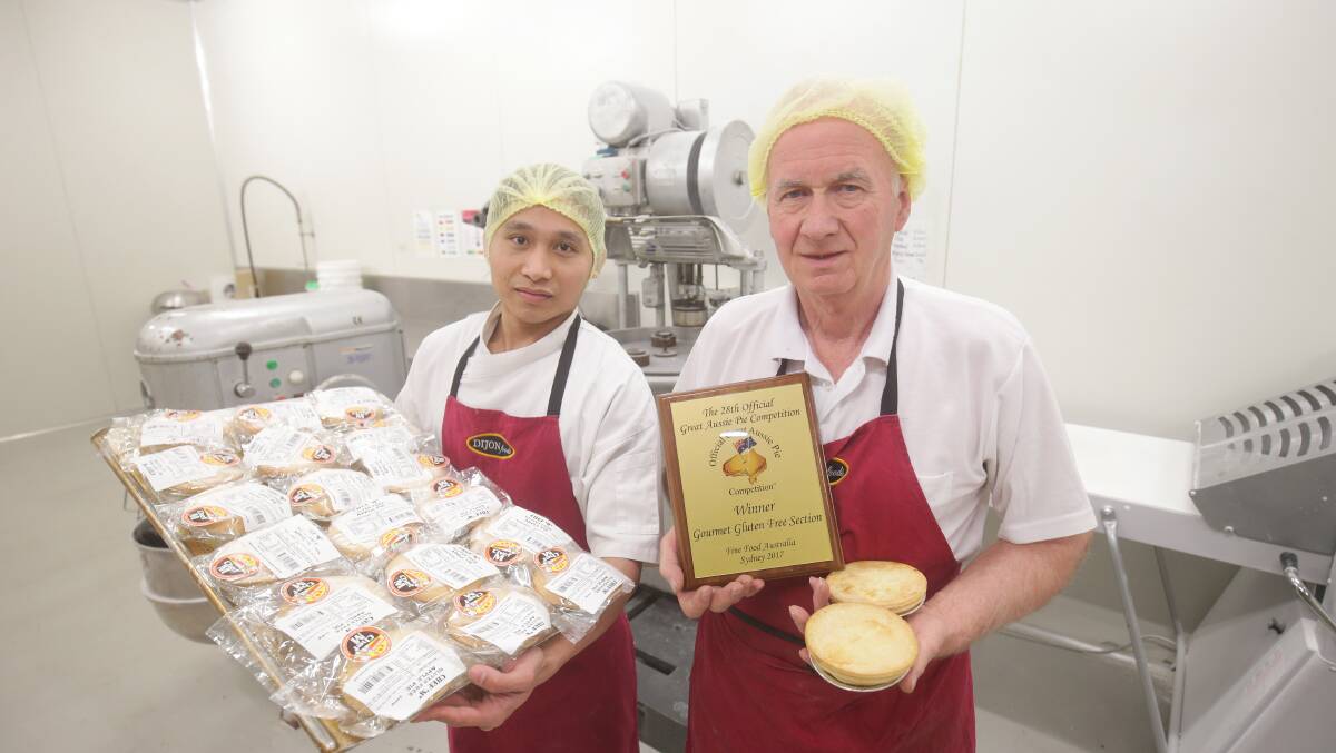 Award winning: Classique Gourmet owner Martin Edwards (right) and employee Leslie Garbo. Picture: Chris Lane 