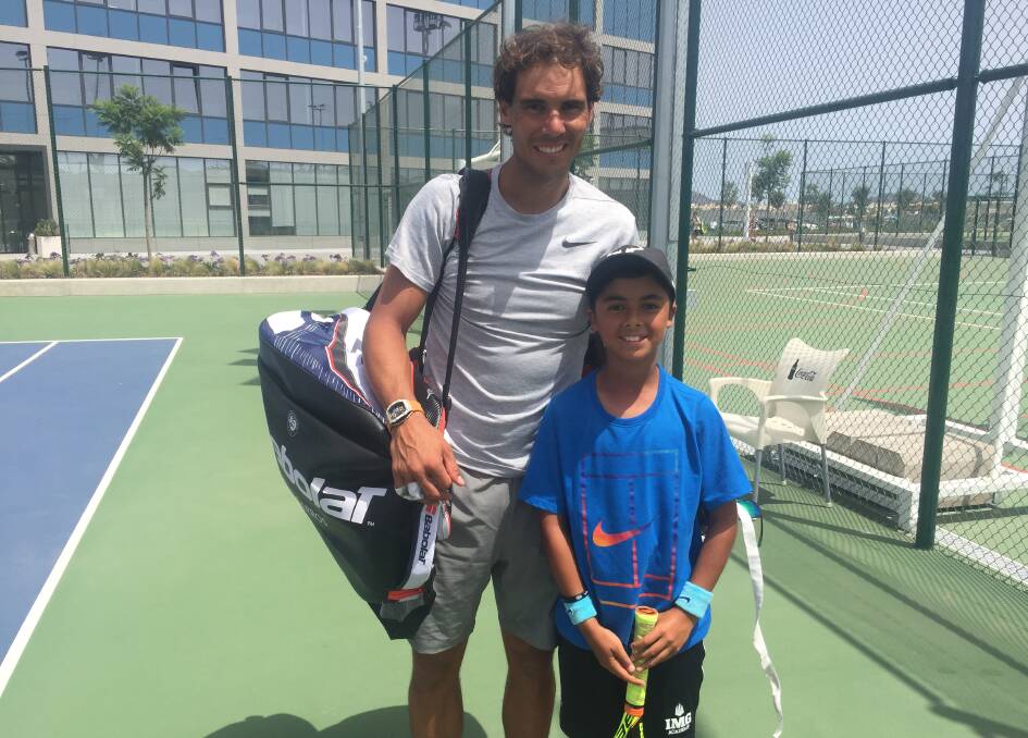 Talent: Young tennis talent Hugo Babakian, pictured with sporting hero Rafael Nadal in July, is off to join the Rafa Nada Academy in Spain. Picture: Supplied