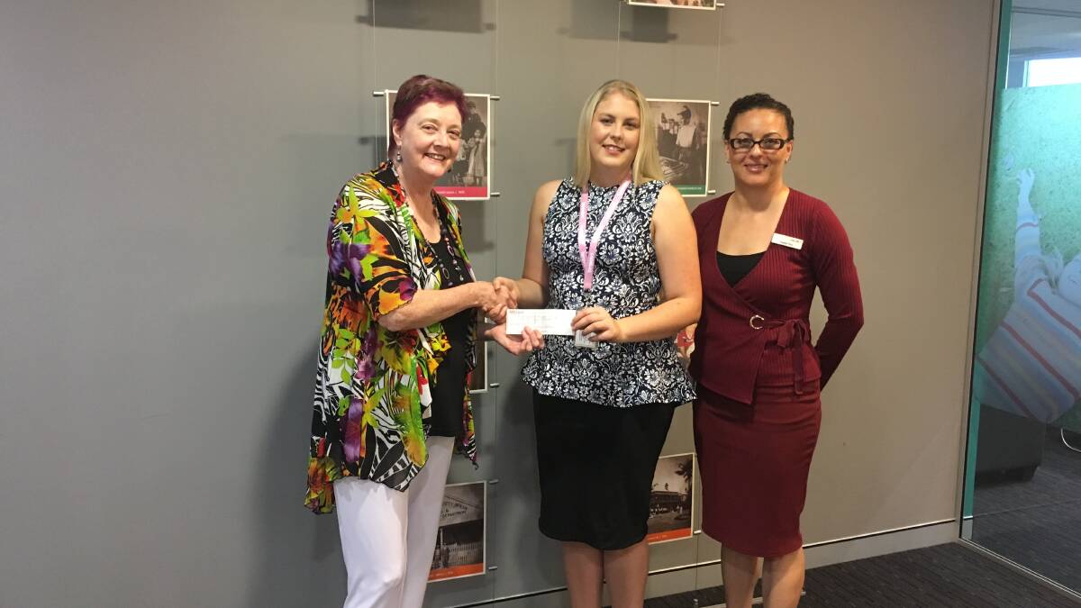 Art therapy: Geraldine Taylor (left), from Oatley 101 Society of Artists, passes on a cheque to Kassandra Isvik from The Benevolent Society. Picture: Supplied
