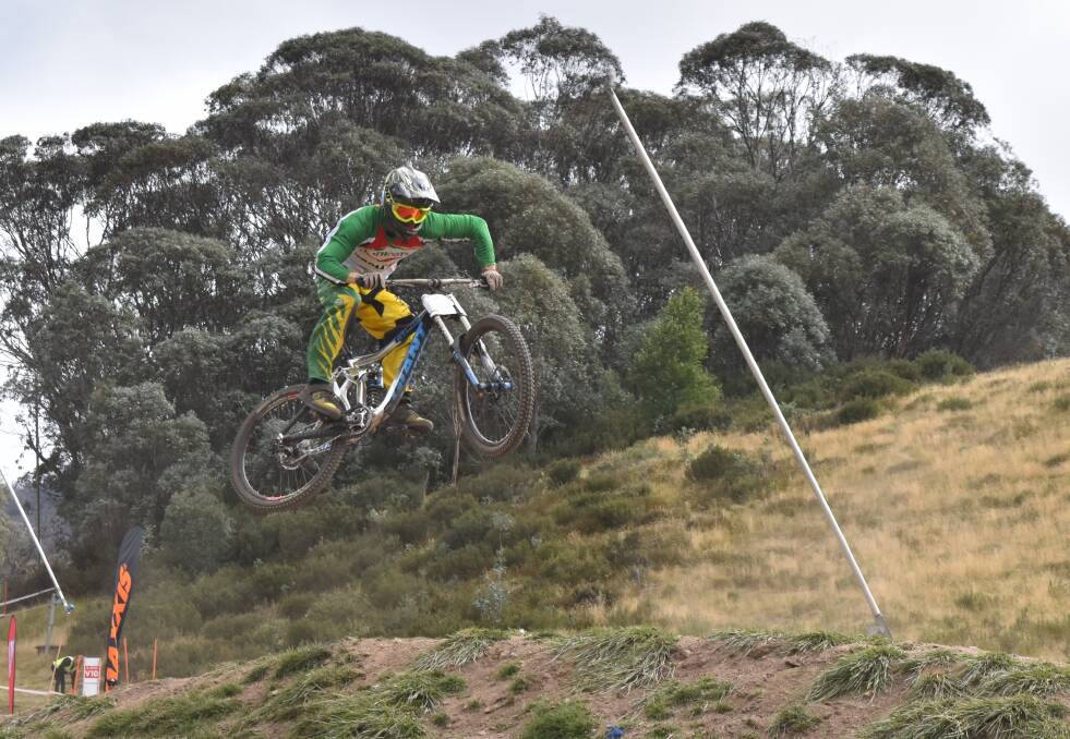 Flying: A Heathcote High School rider goes airborne at the Australian Interschools Mountain Bike Championships held in Thredbo. Picture: Jake and Kylie Voysey