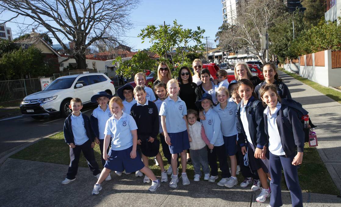Safety risk: Parents are fed up with dangerous traffic conditions outside St Patrick’s Catholic Primary School in Kogarah. Pictured are parents and children near the school. Picture: John Veage