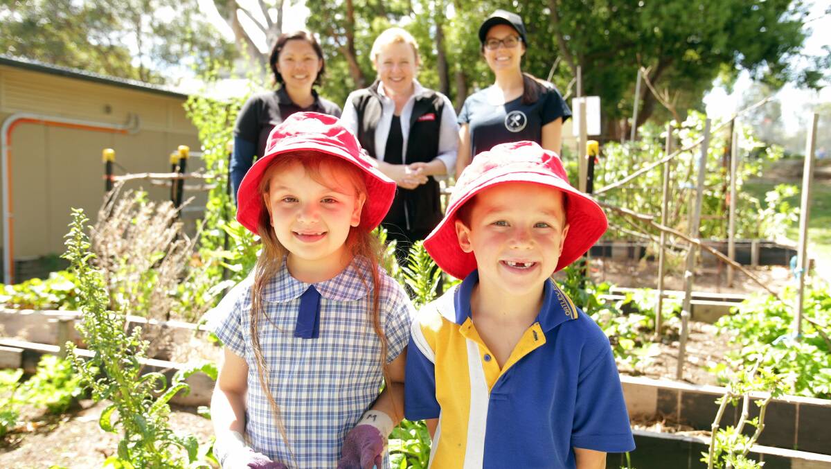 New garden: The school has received a Yates and Junior Landcare grant to build a butterfly garden in its already impressive permaculture garden. Pictured are school children Mia Powney and Luke Curtis, as well as (from back left) Jo Stentiford, Angie Thomas and Jane Donovan. Picture: Chris Lane