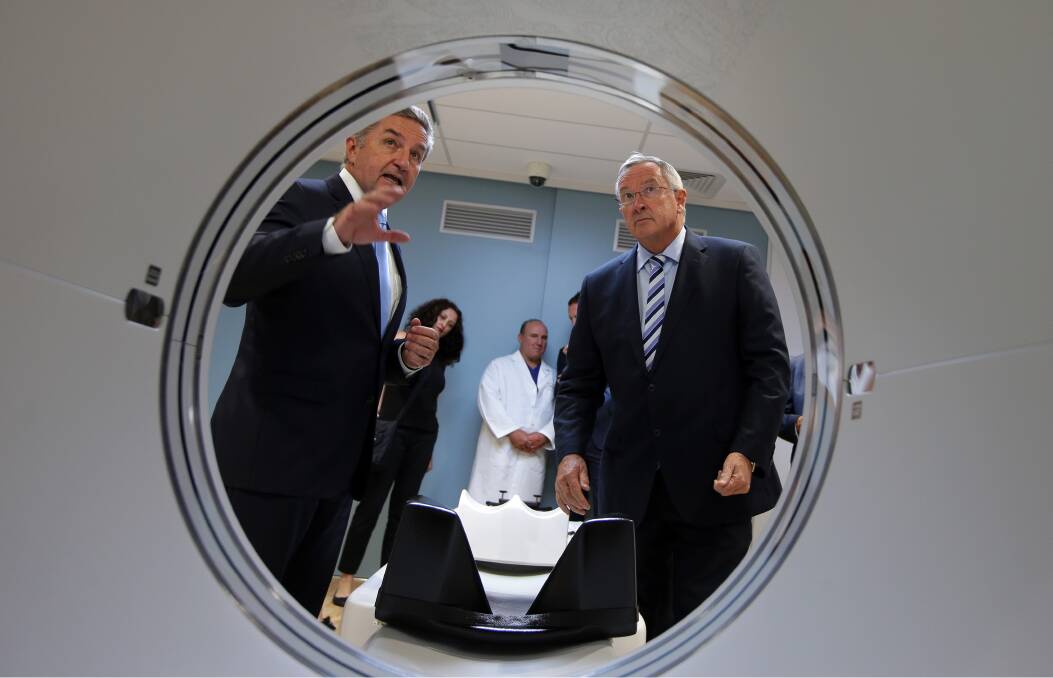 Unveiling: St George Hospital department head nuclear medicine Patrick Butler (left) alongside NSW Health Minister Brad Hazzard on Monday. Picture: John Veage