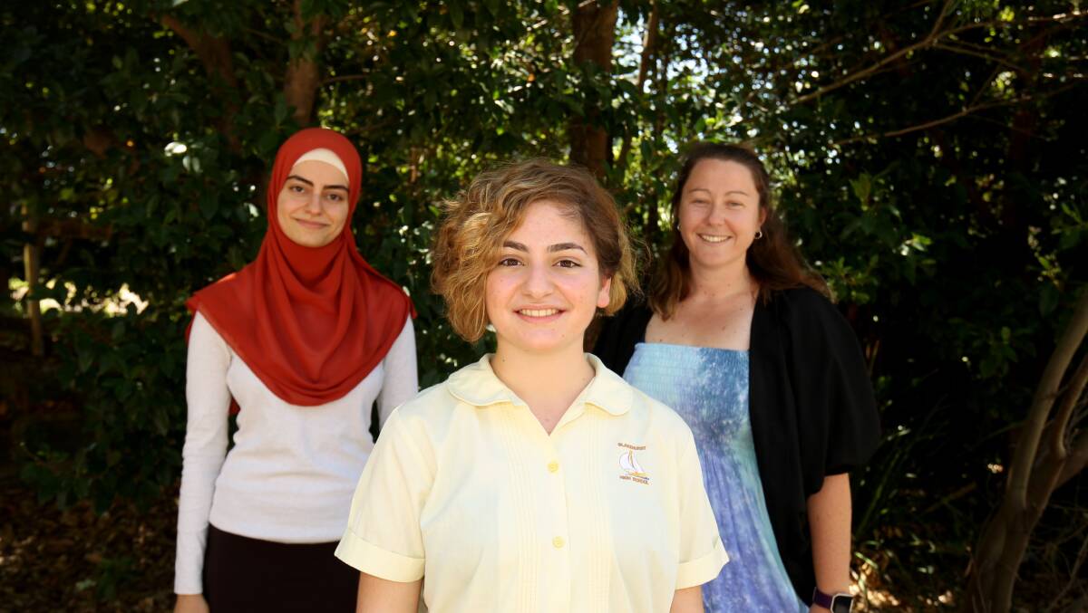 Playwright: Mikayla Hatjinikitas, 16, from Blakehurst High School with her old English teacher Bahia Malas (left) and head of the English department at the school Alexis Heron (right). Picture: Chris Lane