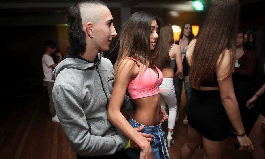 Ali ‘Ziggy’ Mosslmani pictured with his distinctive mullet haircut at a party in Sydney. The image went viral and attracted media stories which Mosslmani claims defame him for being ‘ridiculous’ and ‘ugly’. Photograph: Jeremy Nool