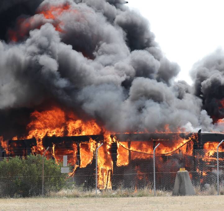 Blaze: Fire engulfs buses at Sydney Airport on Sunday. Picture: Dave Hayes
