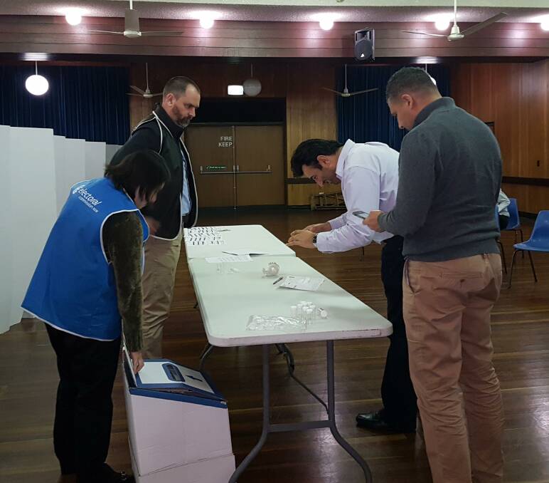 Result: Returning officer Ed Knowles looks on as Bayside Council candidates inspect the ballot during the draw for positions on Wednesday night. Picture: Supplied